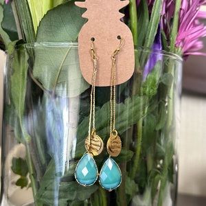 Long gold toned handmade earrings with gorgeous teal teardrop rhinestones